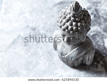 Gray Buddha Statue on Stone Background