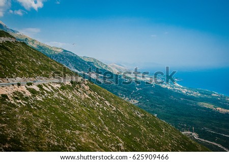 2016, Albania, Llogara National Park, Paraglider over Llogara Pass. Vlore county Royalty-Free Stock Photo #625909466