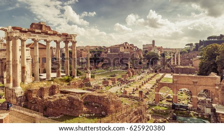 Roman Empire ruins, Rome, Italy. Scenery of Roman Forum or Foro Romano, panorama of Ancient ruins in Roma city center. Vintage style photo, remains of past civilization view, Temple of Saturn in left Royalty-Free Stock Photo #625920380