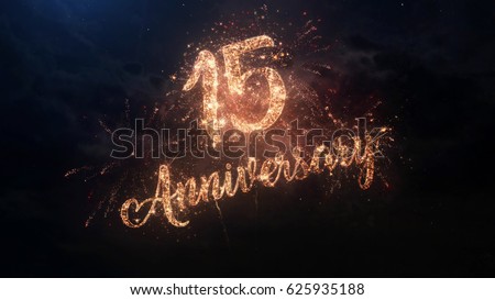 Happy birthday Anniversary 15 years celebration greeting text with particles and sparks on black night sky with colored fireworks on background, beautiful typography magic design.