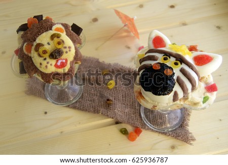 The zebra and lion are made of ice cream. A creative dessert for children and good mood. 