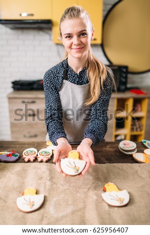Female hands holds sweet cookies with pictures