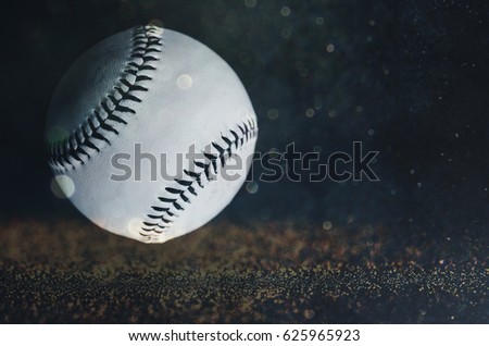 Great background or graphic for baseball athlete.  Shows closeup ball in black and white with sparkle in background.