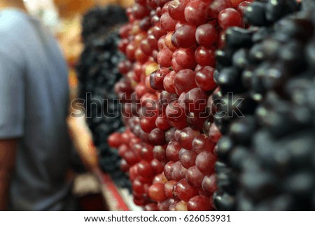 A variety if fresh grape on a local market stand for sale. Selected Focus