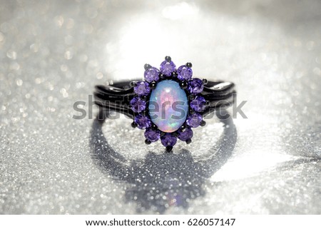Fashion ring decorated with blue fire opal stones.