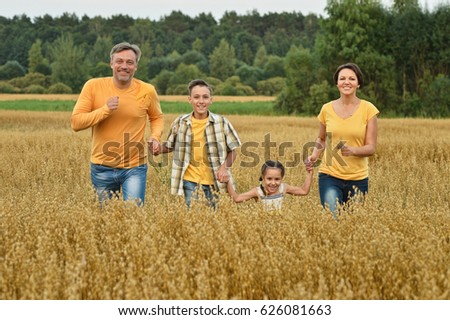 Happy parents with children  outdoors