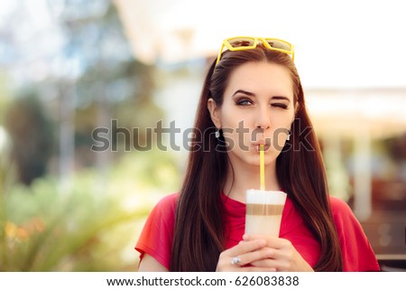 Cool Girl Winking and Sipping Summer Coffee Drink - Portrait of a cute woman with tree colors caffeine beverage

