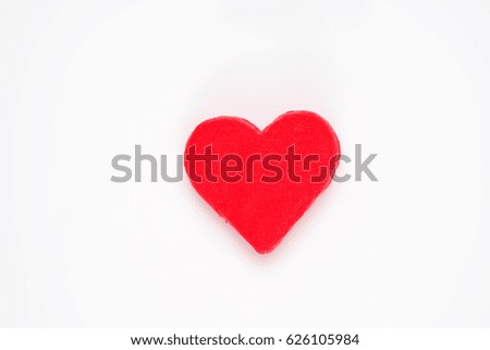 red clay heart on white background
