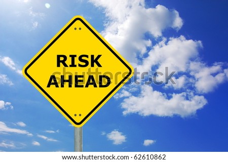 risk management concept with yellow road sign