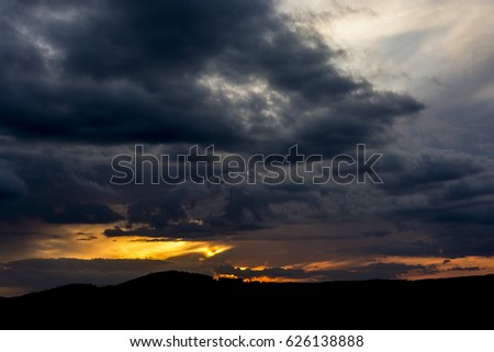 Sunset with partly cloudy sky. Dramatic sky Royalty-Free Stock Photo #626138888