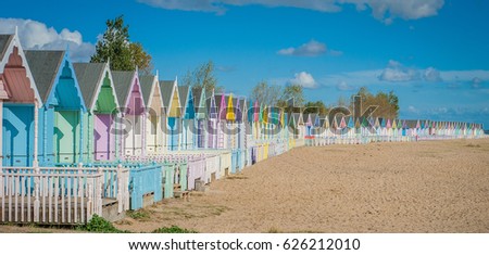 2016 United Kingdom Mersea colorful houses on the coast. Beautiful wide beach with interesting buildings Royalty-Free Stock Photo #626212010