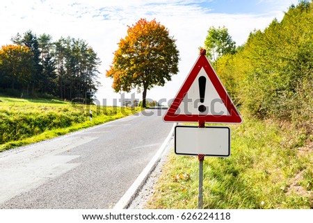 Warning sign on road