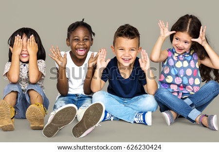 Group of happiness little children sitting on the floor