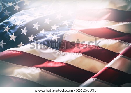 American flag waving in the wind. Royalty-Free Stock Photo #626258333