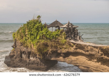 Tanah Lot is one of Bali's most beautiful temples surrounded by the ocean and dedicated to the guardian spirits of the sea