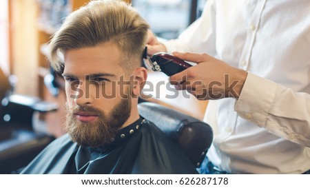 Young Man in Barbershop Hair Care Service Concept Royalty-Free Stock Photo #626287178