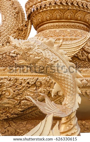 Imagination golden fish statue, Part of Giant candle eagle Garuda statue at Thung Si Muang Park in Ubon Ratchathani Thailand.