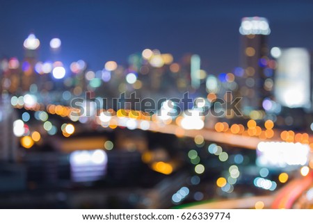City blurred bokeh light and highway road, abstract background