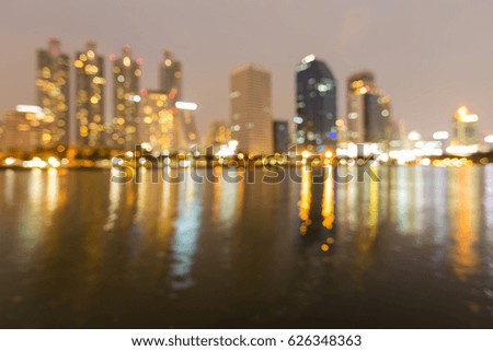 Abstract blurred bokeh light office building water front, abstract background