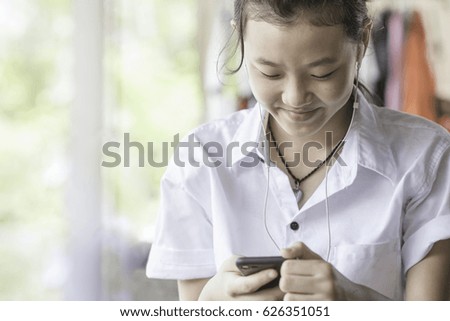 Happiness of young woman with smartphone