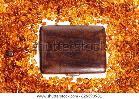 Stones of yellow amber and a wooden box.