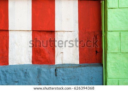 Red, white, green and blue wall texture background with stripes Royalty-Free Stock Photo #626394368