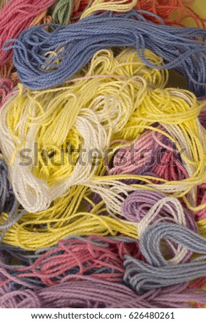 This is a photograph of Pastel multicolored cotton Embroidery background