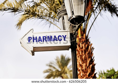 pharmacy sign on the tree of the hotel resort in Egypt