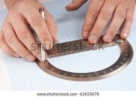 protractor in hand on graph paper