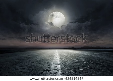 country road at night with large moon Royalty-Free Stock Photo #626514569