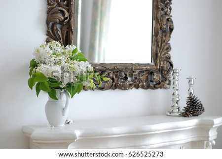 White lilac in front of the mirror