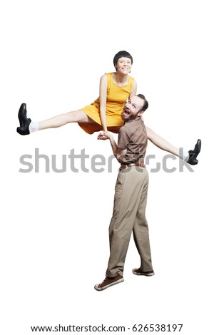 Rock'n'roll dance boogie woogie. Boogie acrobatic stunt in a studio background. Dance for rock-n-roll music. Royalty-Free Stock Photo #626538197