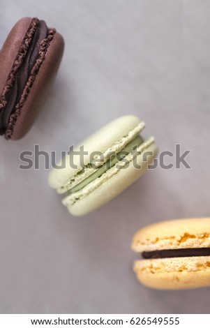 Colorful french macaroons on gray  background from above. Copy space for text. Social media, blogging concept. 