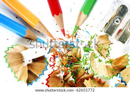 Sharpened pencil and wood shavings.
