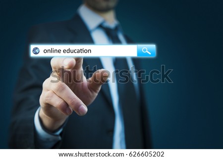 Businessman hand touching online education text on virtual screen