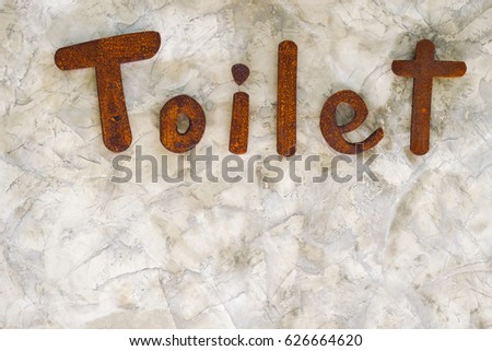 Toilet modern sign label on concrete wall