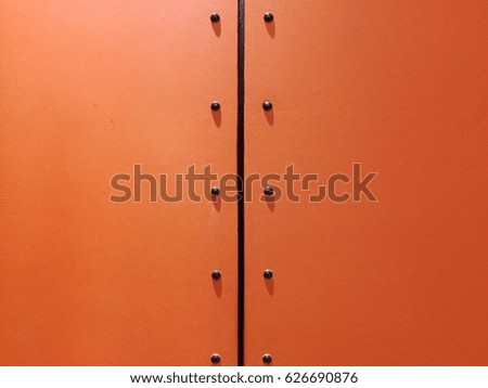 Orange wall with black line on middle for texture background