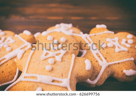 Baking gingerbread men on a wooden background