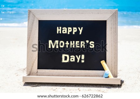 Happy Mother's day background on the sandy beach near the ocean