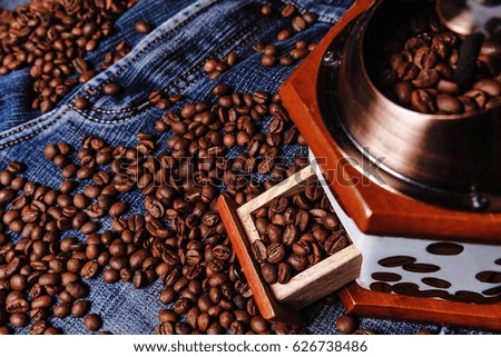 Old Coffee grinder and black coffee beans