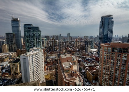 A busy city with tall towers and buildings reaching to the sky