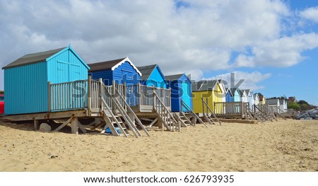 Colourful Beach Huts on Felixstowe Beach Royalty-Free Stock Photo #626793935