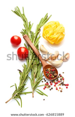 Mediterranean food and drink healthy diet: Fresh vegetables spices and Italian herbs. Top view. Isolated on white. Rosemary cherry tomatoes garlic peppers pasta Royalty-Free Stock Photo #626815889