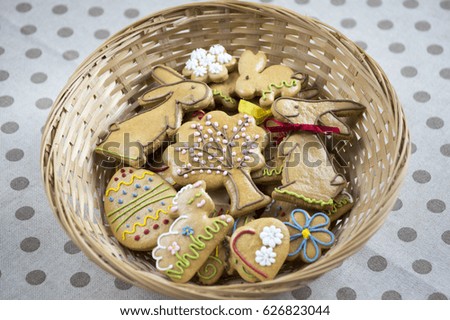 Two funny bunnies dating, Easter homemade gingerbread cookies, light brown sweets with colors