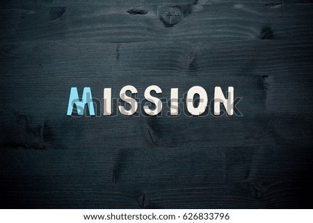 wooden word mission on background business concept