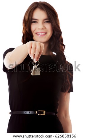 Bright picture of pretty young lady holding keys.