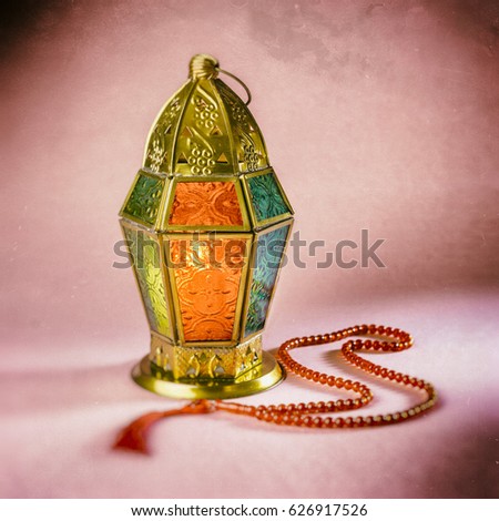An islamic festive background of lantern and rosary. Grunge, vintage effect.