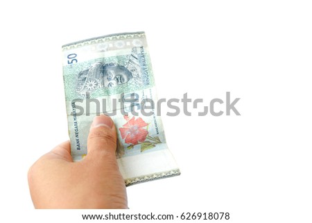 male hand holding malaysia banknotes on white background