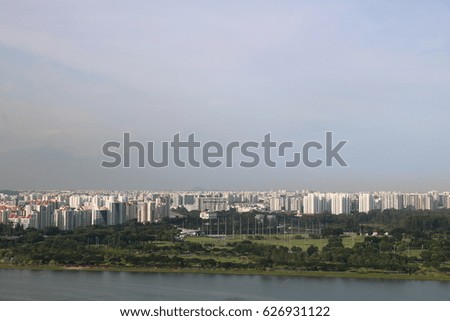 Rare picture of  Singapore city HDB condominium  and green land with trees and blue sky