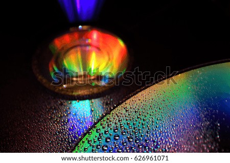 DVD and CD disc with drop colour background